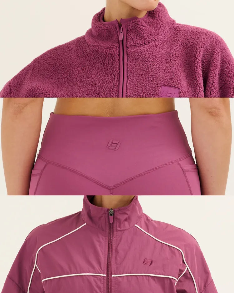 Nova Plum sherpa fleece, racerback sports bra with leggings, and piped track jacket
